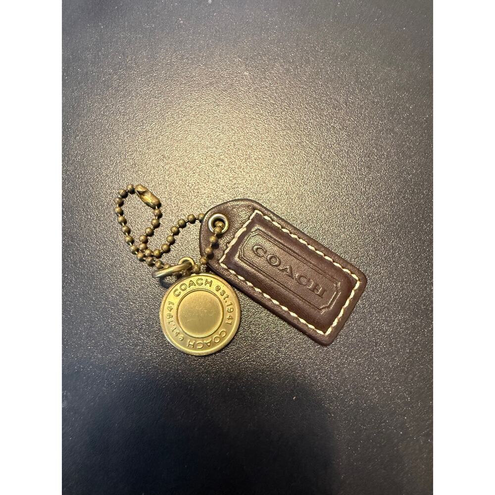 Vintage Coach hangtag brown  with brass round medallion